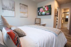 a bedroom with a white bed in a room at 5079 Lotus Street in San Diego