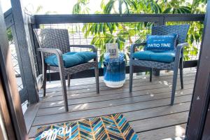 a porch with two chairs and a bottle of water at 5079 Lotus Street in San Diego