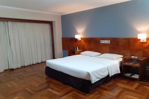 En eller flere senge i et værelse på Hotel Amantykir