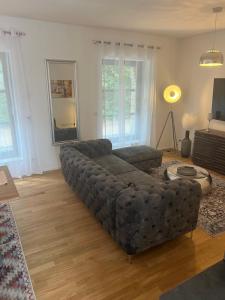 a living room with a couch and a table at Luxuswohnung Nähe Köln Bonn in Troisdorf