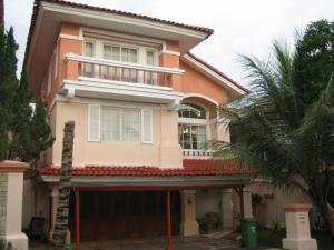 a pink house with a gate and a palm tree at Private Villa with Swimming Pool in Babakan Madang