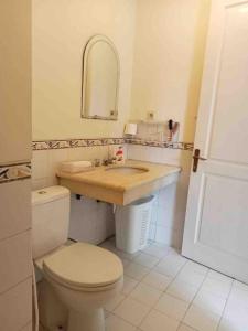 a bathroom with a toilet and a sink at Private Villa with Swimming Pool in Babakan Madang