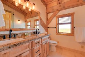 a bathroom with a sink and a toilet at 23 Mi to Targhee Skiing Felt Cabin with Hot Tub! in Felt +37 photos