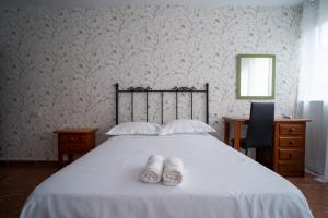 Postel nebo postele na pokoji v ubytování La Casa de Lita