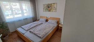 Ένα ή περισσότερα κρεβάτια σε δωμάτιο στο Ferienwohnung Müller +7 φωτογραφίες