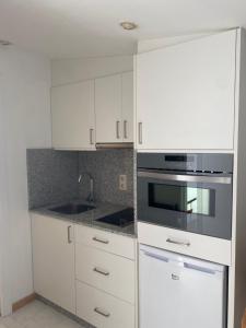Kuchyňa alebo kuchynka v ubytovaní Apartamentos OLIVA
