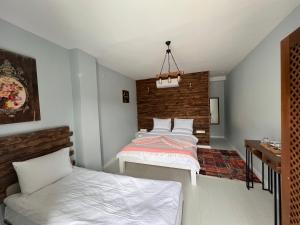 Postel nebo postele na pokoji v ubytování ALAÇATI XL LUXURY HOTEL