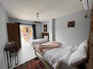 Postel nebo postele na pokoji v ubytování ALAÇATI XL LUXURY HOTEL