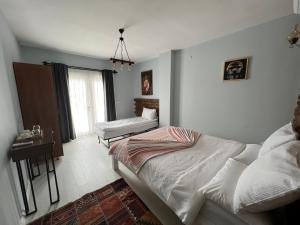Postel nebo postele na pokoji v ubytování ALAÇATI XL LUXURY HOTEL