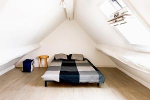 a bedroom with a bed in a attic at LMK in Serris