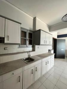Kuchyň nebo kuchyňský kout v ubytování Blue Wave Apartment
