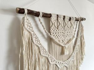 a white crochet curtain hanging on a wall at Central City Beach Pad in Brighton & Hove