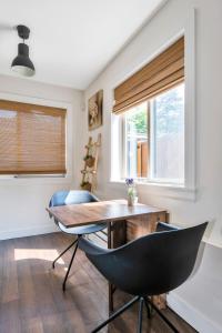 a dining room with a table and chairs at Minimal - 30 nights minimum in Vancouver