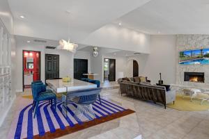 a large living room with a couch and a table at Our Poolside Desert Nirvana in Palm Springs