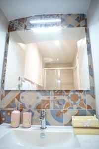 a bathroom with a sink and a mirror at Il Germoglio in Bisceglie