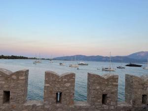 a view of a body of water with boats at Madame Parisienne in Nafpaktos