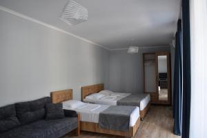 A bed or beds in a room at жули