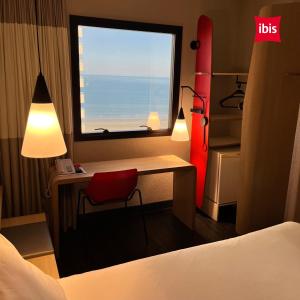 Postel nebo postele na pokoji v ubytování ibis Santos Gonzaga Praia