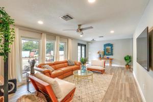 a living room with a couch and a table at Vero Beach Vacation Rental Pool and Putting Green! in Vero Beach