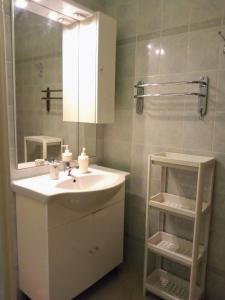a bathroom with a sink and a mirror at Apartmani Brkic - Seaview apartments - Sand beach in Nin