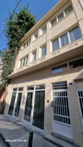 a building with a white door on a street at 7ATHENS in Athens