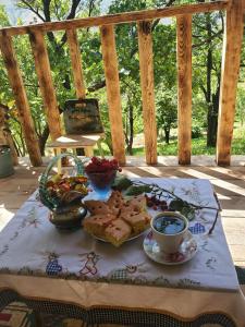 a table with a plate of food and a cup of coffee at mesxta in Nak'alak'evi