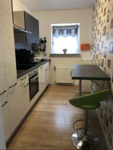 Kuchyň nebo kuchyňský kout v ubytování Krune Ferienwohnung + 7 fotografií