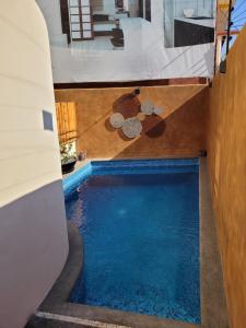 a swimming pool in the middle of a building at Boutique Condo Close to Everything in Zihuatanejo