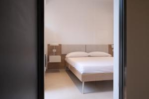 Voodi või voodid majutusasutuse Nautika Suites toas