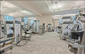 a gym with treadmills and machines in a building at Signature MGM Suite with Strip and Sphere View in Las Vegas