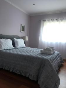 Postel nebo postele na pokoji v ubytování Camelias + 2 fotografie