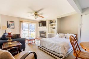 a bedroom with a bed and a living room at SKIING, HIKING, VILLAGE OF EVILLE MTN ESCAPE in Ellicottville