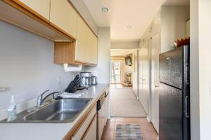 a kitchen with a sink and a refrigerator at SKIING, HIKING, VILLAGE OF EVILLE MTN ESCAPE in Ellicottville