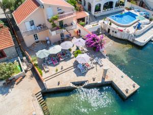 an aerial view of a house with a swimming pool at Apartments Novo Mulo in Tivat