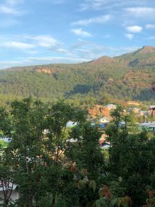 a view of a valley with trees and mountains at Hotel JADE in Mesa Colorada