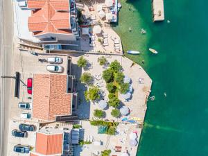 an overhead view of a beach with buildings and the water at Apartments Edera in Tivat