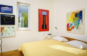 Ένα ή περισσότερα κρεβάτια σε δωμάτιο στο Apartmani Villa Mara