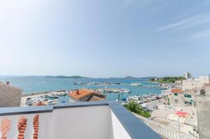 a balcony with a view of a marina at Apartments Villa Vista Sol in Vodice