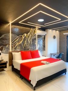 En eller flere senge i et værelse på Hotel Calle Real - INN