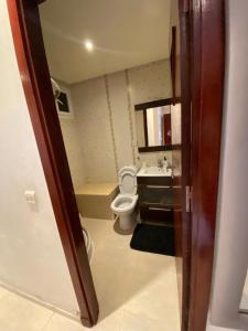 a bathroom with a toilet and a sink at appartement rabat agdal in Rabat