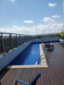 a swimming pool on the roof of a building at Apto Hotel Blue Tree Manaus in Manaus