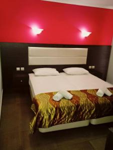 Un pat sau paturi într-o cameră la Hotel Niko Paradise