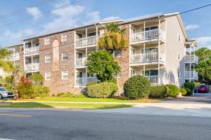 an apartment building with a street in front of it at Surfside Beach Condo with Ocean Access and Balcony! in Myrtle Beach