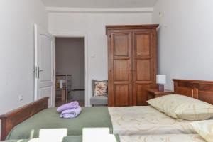 a bedroom with two beds with towels on them at Vizmeg Holiday Home in Dubrovnik