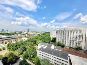an overhead view of a city with buildings and trees at City Centre top floor Apartment in Warsaw