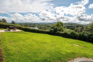 a picnic table in a field of green grass at Bradleys Cottage Creeslough in Creeslough