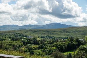 a view of a valley with mountains in the distance at Bradleys Cottage Creeslough in Creeslough