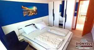 A bed or beds in a room at Arode Villa Dionysus