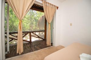 Postel nebo postele na pokoji v ubytování Hotel Ak'Na Holbox