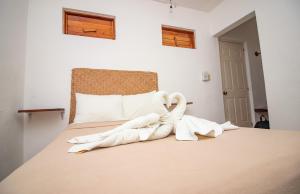 Postel nebo postele na pokoji v ubytování Hotel Ak'Na Holbox